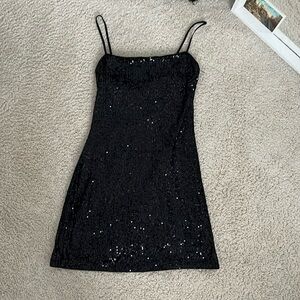Sparkly, black, good condition mini dress!